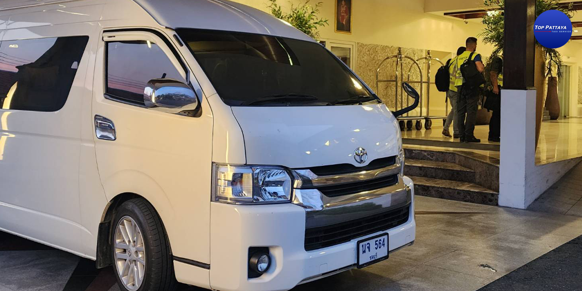 White VIP van at a hotel pickup area