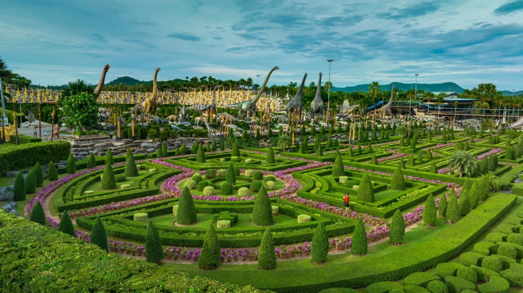 Beautifully manicured French garden and Dinosaur Valley at Nong Nooch Tropical Botanical Garden in Pattaya.
